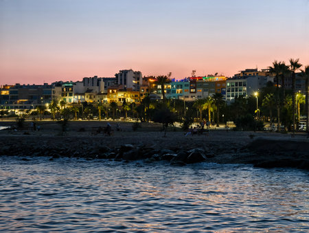 serene scene, calm maritime nightscape featuring distant and reflective watersの写真素材