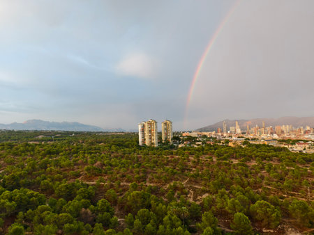 drone captures peaceful scenery, drone footage showcases tranquil forest and mountain viewの写真素材