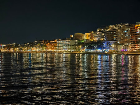 colorful waterfront with lively reflections, luminescent seafront nightlife with dancing reflectionsの写真素材