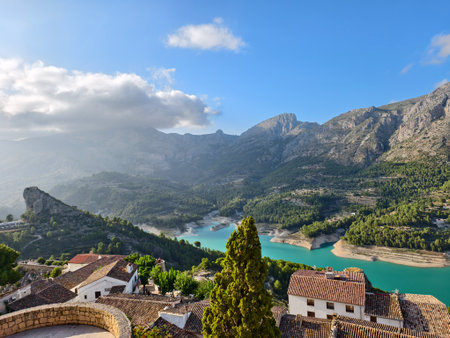 dramatic sky over mountain lake, cinematic mountain silhouette with vibrant sky and dynamic lightingの写真素材