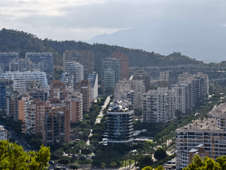 urban view with parks and towers, aerial image highlighting city center and infrastructureの写真素材