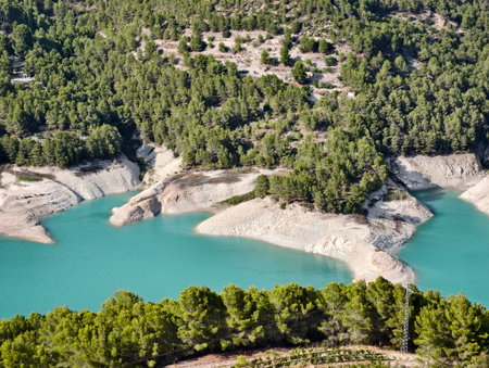 cove featuring turquoise waters and rocky banks, rocky bay with exposed banks and vibrant turquoiseの写真素材