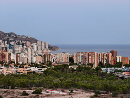 seaside buildings with vibrant cityscape, cluster of buildings along coastal ridge with sea viewsの写真素材