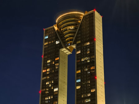 night skyline with luminous towers, vivid night scene with shining twin towers and city lightsの写真素材