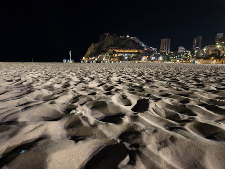 closeup of rippled sand under night shadows, dramatic textured sand with shadows in night beachの写真素材