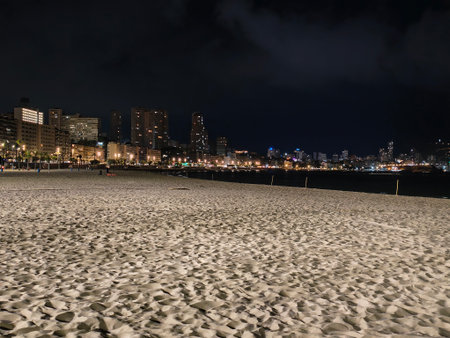 silent beach night, quiet night on beach, calm and silent night beneath cloudy skies on beachの写真素材