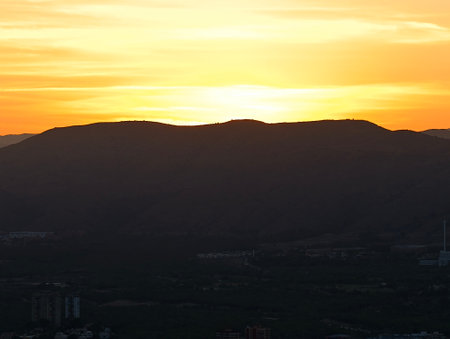 peaceful sunset gently disappears from view, tranquil sunset gradually fades into evening darknessの写真素材