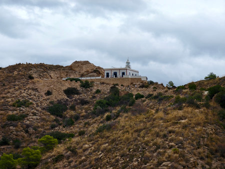 chapel by bay, serene chapel on ridge offering beautiful views of bay below and surrounding sceneryの写真素材