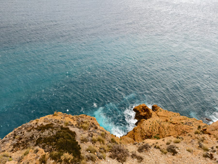 beautiful snorkeling spot, turquoise cove with clear waters, cliff view of vivid aqua coveの写真素材