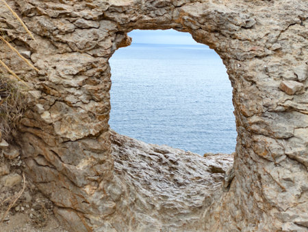 peaceful seaside scenery for relaxation, calm oceanic scene with rugged cliffs and horizonの写真素材