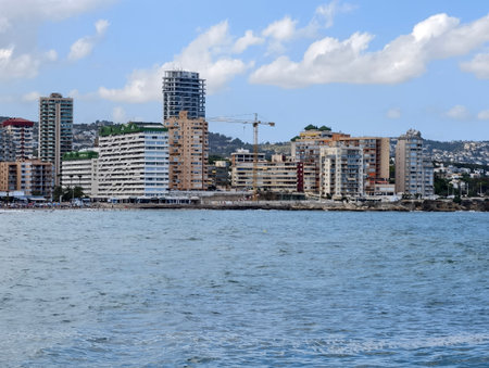 seaside view, modern coastal view with buildings, bright seaside scene featuring buildingsの写真素材
