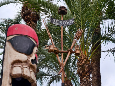 seaside pirate decor, pirate inspired coastal mast featuring hanging skulls and rustic elementsの写真素材
