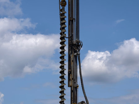 steel auger with visible wear, massive spiral auger showcases industrial precision in metallic