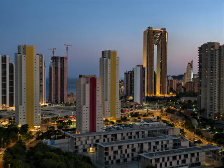 city lights illuminate bustling streets, city transforms at dusk with glowing buildings and busy