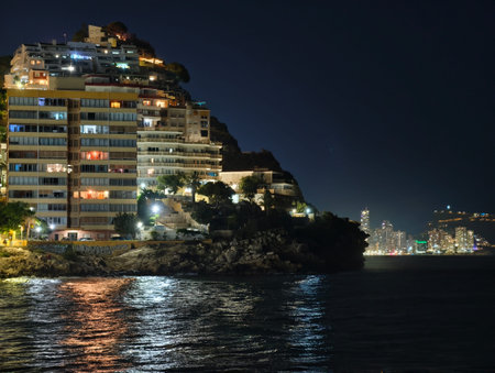 upscale cliffside water view, refined waterfront residences with ambient lighting and panoramicの写真素材