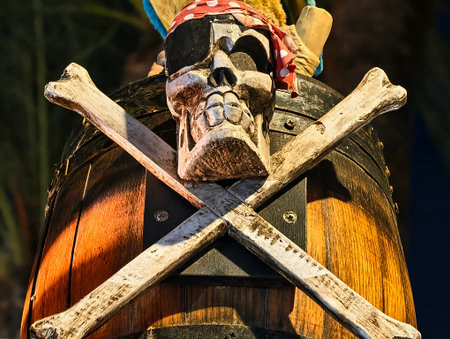 A striking pirate theme featuring a skull, crossbones, and a wooden barrel, perfect for adventure and fantasy imagery.の写真素材