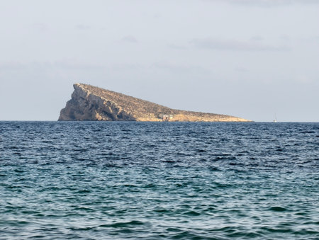 islet oversea tranquility, islet amid calm turquoise waters, solitary rocky islet rises in tranquilの写真素材