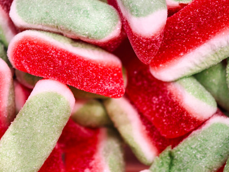 colorful sweet treats, vivid candy strips with sparkle, juicy chewy sticks with sugar shimmerの写真素材