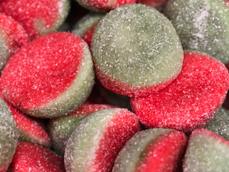 vivid treat with sparkling sugar coating, macro shot showcasing vibrant chewy candies with festiveの写真素材