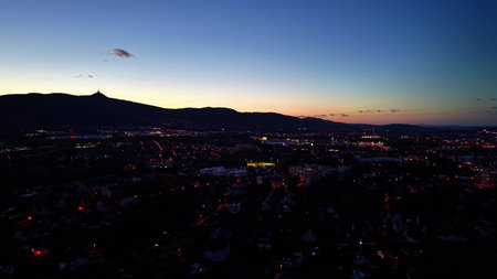 Skyline at twilight with city lights, City skyline illuminated during blue hour with vibrant...