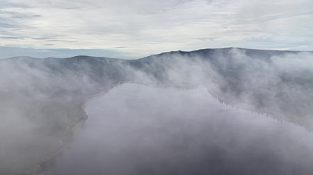 Foggy surroundings boost filming, Layered fog and thick cloud formations elevate cinematic visual effects and atmosphereの写真素材