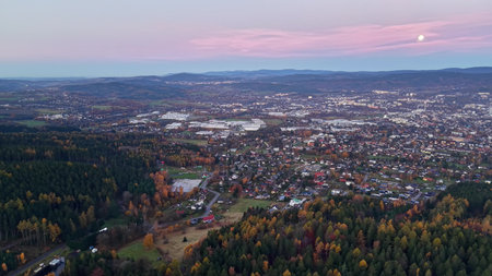 serene dusk scene with trees, calm cityscape at sunset with colorful skyの写真素材