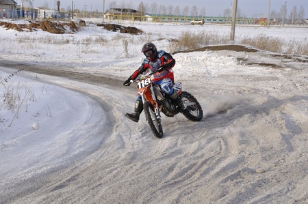 Russia, Samara - January 15,2011, motocross, motorcycle unknown riders, turn accelerated the dusty trailのeditorial素材