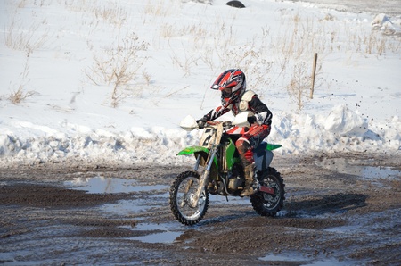 motorsport MX 65 cm3. Junior rider moving on straight section of highwayの写真素材