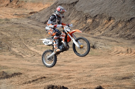 RUSSIA, SAMARA - APRIL 30: Take off on big hill on a motorbike the rider of E. Pershin the Regional Motocross Championship on April 30, 2011 in Samara, Russiaのeditorial素材