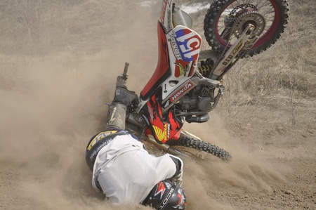 RUSSIA, SAMARA - APRIL 30: Motocross unknown rider on the a motorbike falls the Regional  Motocross Championship on April 30, 2011 in Samara, Russiaのeditorial素材