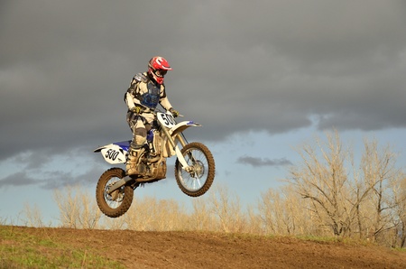 A motorcycle racer lands on the rear wheelのeditorial素材