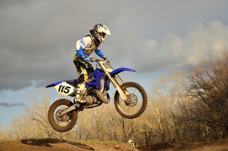 A motorcycle racer lands on the rear wheelのeditorial素材