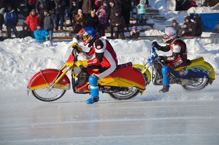 SAMARA, RUSSIA - JANUARY 29: Two motorcyclists competing in the straight part of the ice track, Ice Speedway the Cup of Russia January 29, 2012 in Samara, Russiaのeditorial素材