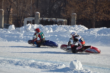 SAMARA, RUSSIA - JANUARY 29: Two rival motorcyclists on corner exit icy track, ice speedway Cup of Russia January 29, 2012 in Samara, Russiaのeditorial素材