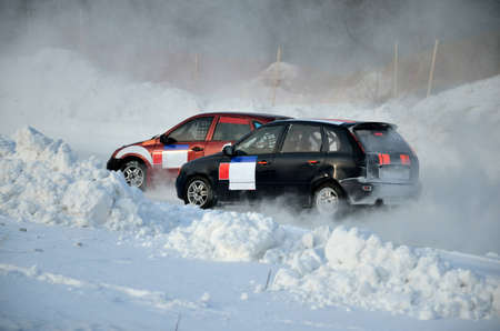 Two cars together on an input in turn track, automobile ice on raceの写真素材