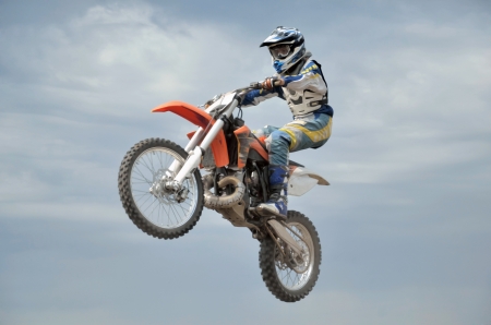 The spectacular control of the motorcycle motocross in flightの写真素材