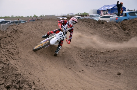 RUSSIA, SAMARA, TOLYATTI - MAY 6: MX unknown rider turns veering with proslipping and large slope, the Regional Motocross May 6, 2012 in Tolyatti, Samara, Russiaのeditorial素材