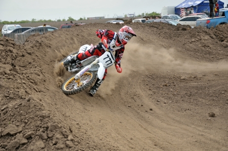 Motocross rider A. Shitikov veering point-blank of clay with a large plume out from under the rear wheel, the Regional Motocross Championship on Mau 6, 2012 in Samara, Russiaのeditorial素材