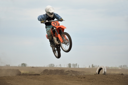 RUSSIA, SAMARA  MAY 6: Young MX racer I. Bolshakov on a  jumps from a hill, the 85 sm3 class the Regional Motocross Championship on May 6, 2012 in Samara, Russiaのeditorial素材