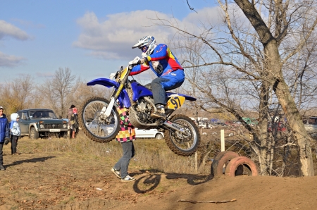 RUSSIA, SAMARA  NOVEMBER 5: The start of the departure racer V. Sorokin on a motorcycle from the hill on track MX the Regional Motocross Championship on November 5, 2011 in Samara, Russia  のeditorial素材