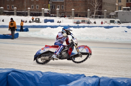 SAMARA, RUSSIA - JANUARY 19: Rider rides a motorcycle with spikes on the rear wheel in the corner exit on the ice speedway the Cup of Russia January 19, 2013 in Samara, Russiaのeditorial素材