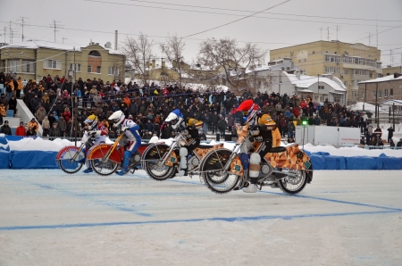 SAMARA, RUSSIA - JANUARY 19: Start of the race at the bikes with spikes on the background of the stands with spectators, motorcycle races ice the Cup of Russia January 19, 2013 in Samara, Russia のeditorial素材