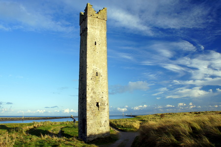 Tower near the river flows into the seaの写真素材