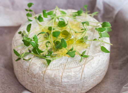 Camembert with thyme and olive oil for bakingの写真素材