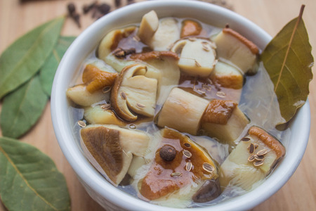 marinated mushrooms with spices and seasoningsの写真素材