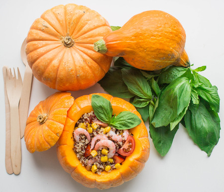 pumpkin quinoa stuffed with tomatoes, corn and shrimpの写真素材