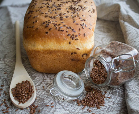 bread with flax seed on a linen towelの写真素材