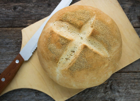 freshly baked wheat bread on a wooden Board