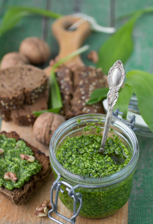Ramson, wild garlic and sauce pesto on a wooden tableの写真素材