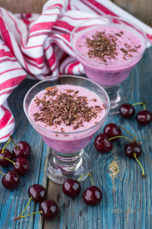 Smoothies. Dairy dessert with cherries and chocolate. Selective focusの写真素材